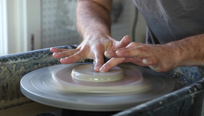 Use your fingers to further refine the shape, ensuring it's about ½ to ¾ inch thick in the center.