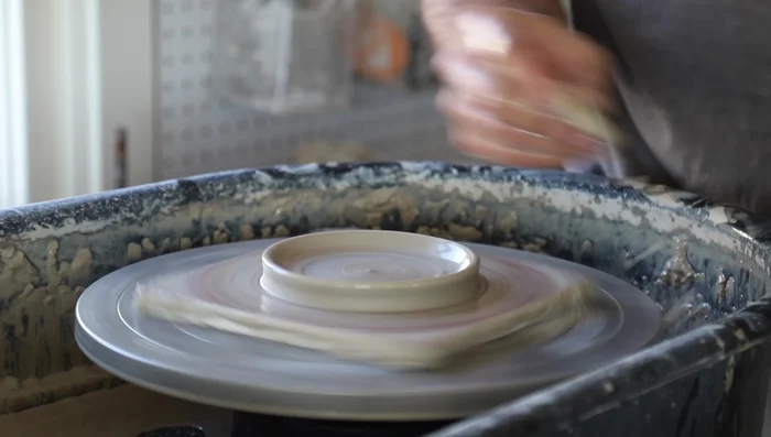 Create a flat area on one side for the spoon handle by pushing down and shaping with your fingers.