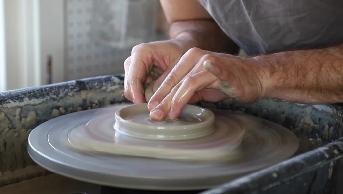 Create a flat area on one side for the spoon handle by pushing down and shaping with your fingers.