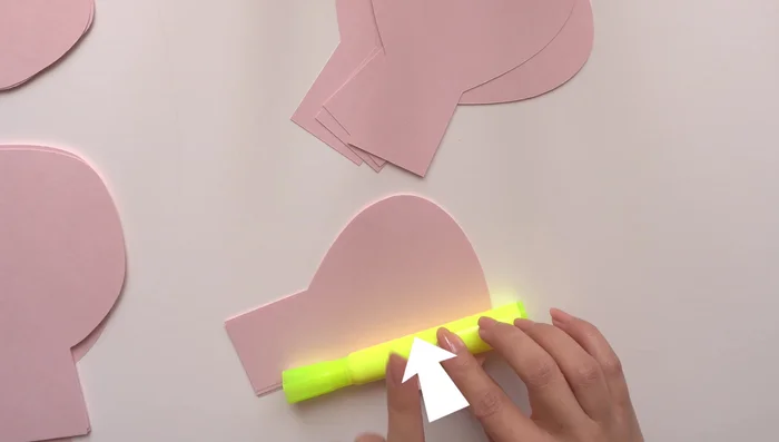 Curl the petals: Curl each petal individually using a rounded object (like a highlighter) to create inward curves. Pay attention to the direction of the curl for each petal size and how much you curl it.