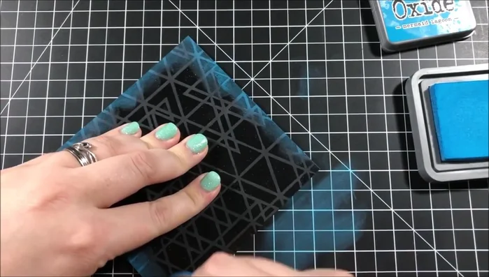 Distress the edges of the background with Mermaid Lagoon Distress Oxide Ink.