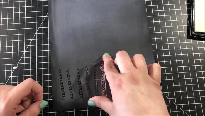 Cut out embossed candles using a Scan N Cut machine.