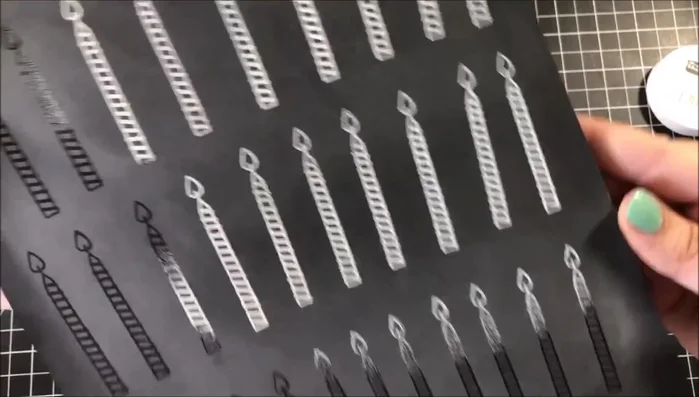 Cut out embossed candles using a Scan N Cut machine.