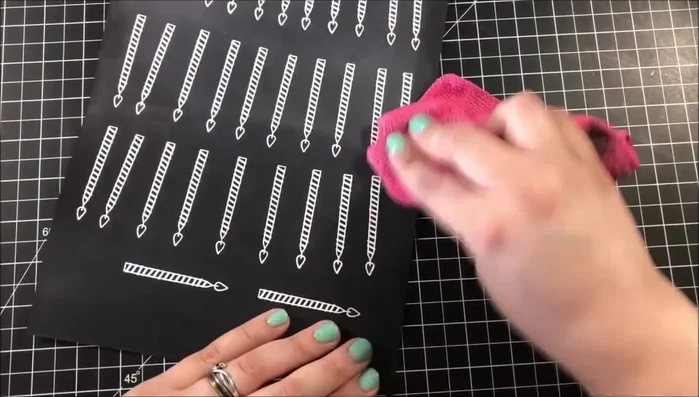 Cut out embossed candles using a Scan N Cut machine.