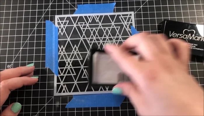 Distress the edges of the background with Mermaid Lagoon Distress Oxide Ink.