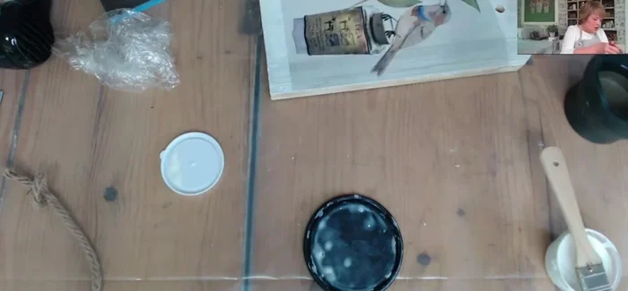 Apply a top coat of decoupage medium to seal the paper.