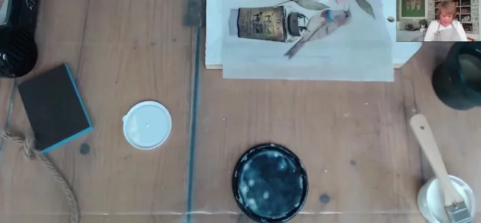 Apply a top coat of decoupage medium to seal the paper.