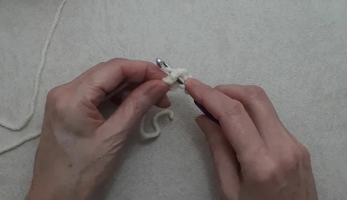 Work three double crochet in the ring.