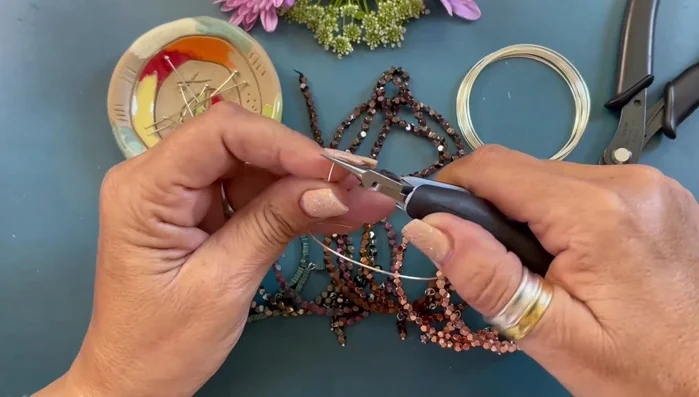 Use round nose pliers to neatly roll and secure the loop.