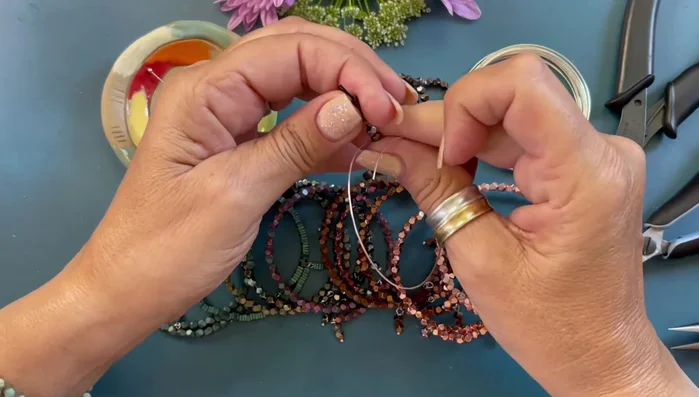 String beads onto the memory wire.