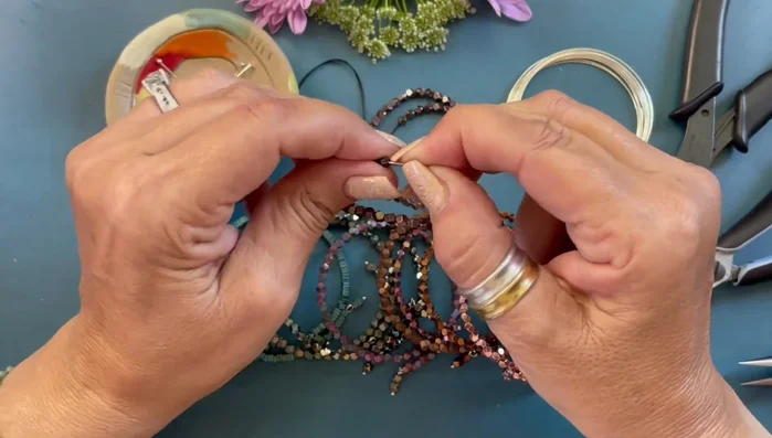 Form a simple loop at the other end of the wire, securing the beads.