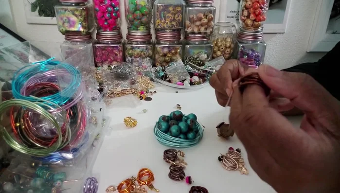 Start with the focal bead: Thread the leather bead onto the wire.