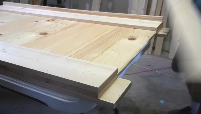 Attach the top cap (1x4 board) using brad nails and screws.