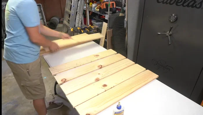 Cut off the end tongue of the final glued board to create a flush surface for attaching other components.