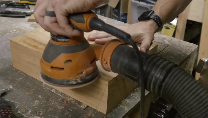 After the glue dries, remove excess glue squeeze-out with a scraper. Sand the knife block using 150-grit and then 220-grit sandpaper.