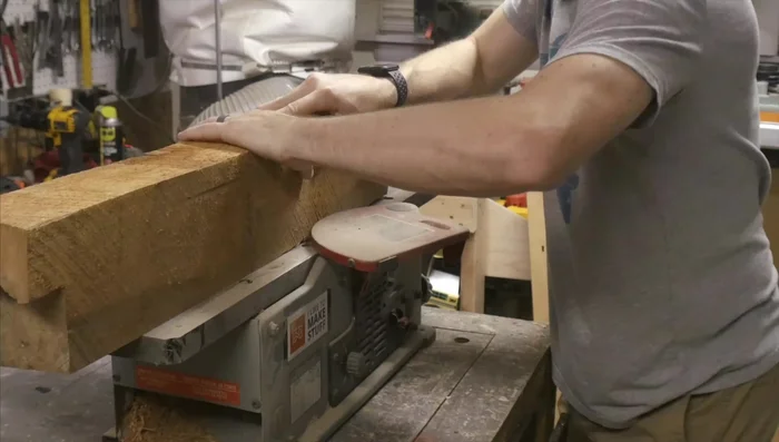 Clean up one end of the board using a chop saw.
