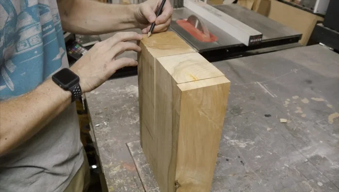 Reassemble the pieces in the correct order. Mark the location for the knife slots.