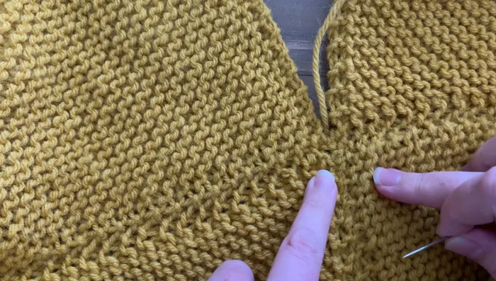 Seam the four panels together, aligning garter ridges to form a diamond pattern in the center. Use your preferred seaming method (e.g., zigzag seam).