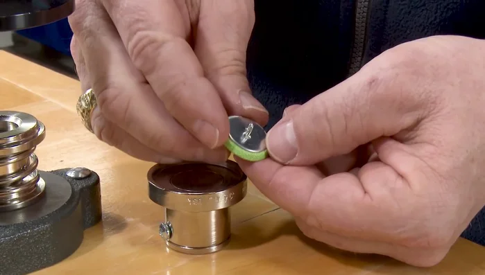 Remove the upper die and your finished button.