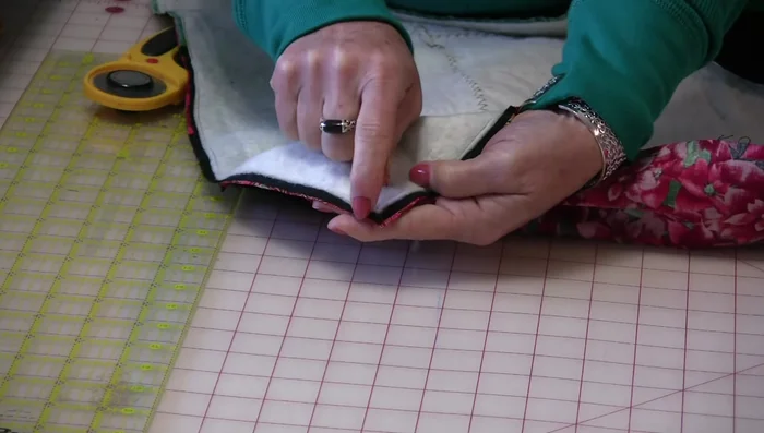Clip corners: Make small snips into the corners of the seam allowance, being careful not to cut the stitches.