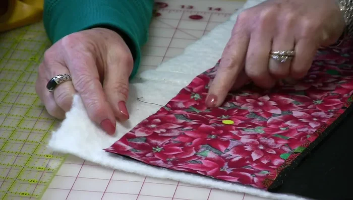 Clip corners: Make small snips into the corners of the seam allowance, being careful not to cut the stitches.