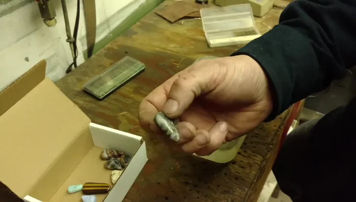 Drill a hole in the top of each stone using an air-powered drill with diamond bits and water for cooling and safety.