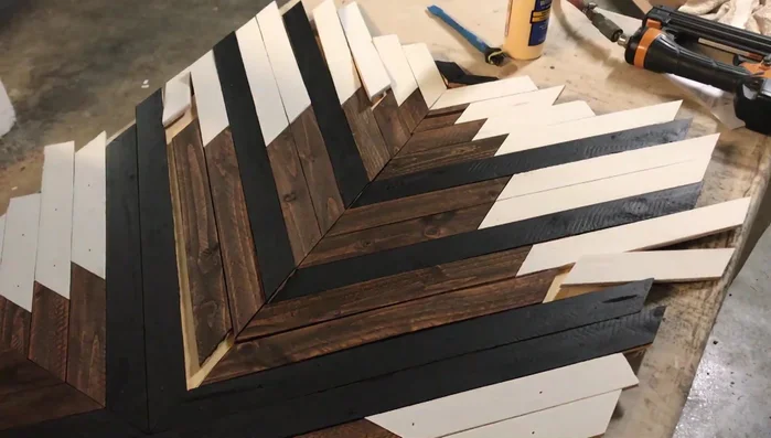 Cut the edges of the sign, ensuring accuracy by measuring from the middle and following the pattern.