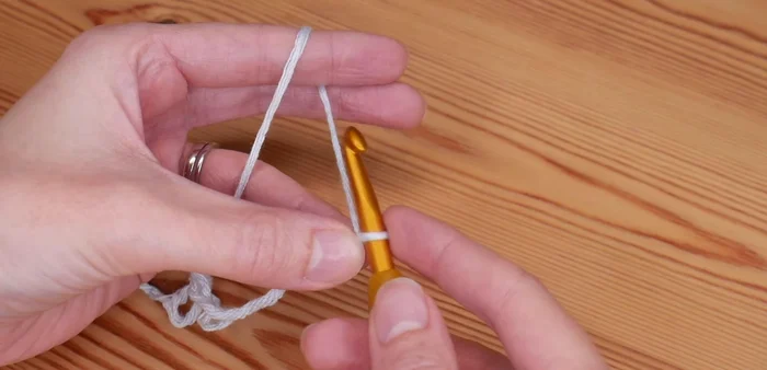 Create a foundation chain in a multiple of three, plus two extra chains. (Example: 21 + 2 = 23 chains)