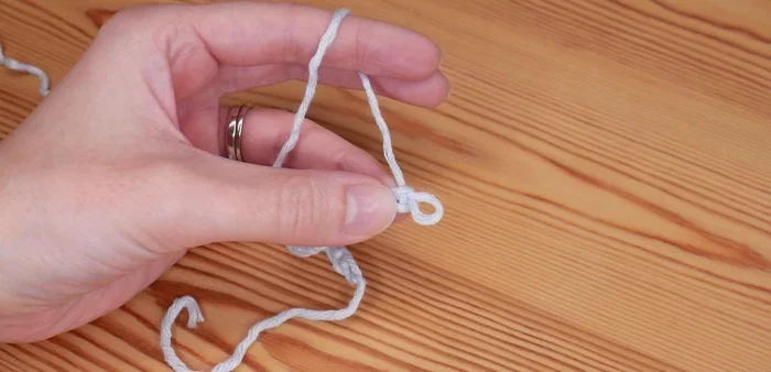 Skip the next two chains. In the third chain, repeat step 4 (2 trebles, chain one, 2 trebles).