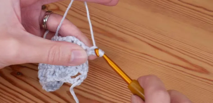 For a straight edge finish: Chain 2, skip to the next chain-one space, slip stitch. Chain 3, skip to next chain-one space, slip stitch. Repeat until the end of the row. Chain 2, treble into the top of the turning stitch.