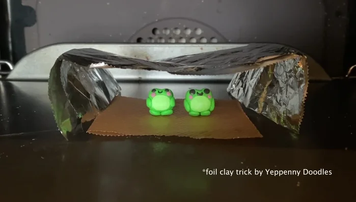 Bake the frog in the oven at the appropriate temperature for polymer clay (information not explicitly stated in the transcript).