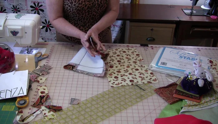 Stitch the handles down along the seam allowance.