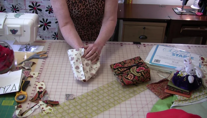 Insert the outer bag into the lining, matching seams. Stitch close to the Soft & Stable around the top.