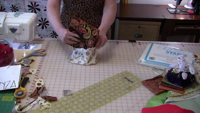 Insert the outer bag into the lining, matching seams. Stitch close to the Soft & Stable around the top.