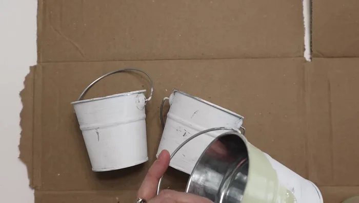 Attach the pales to the repurposed frame using hot glue.