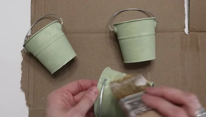 Attach the pales to the repurposed frame using hot glue.