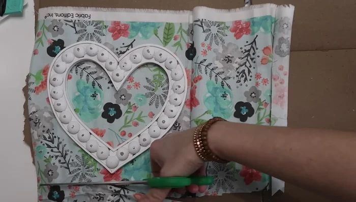 Attach a painted wooden dowel to the back of the heart.