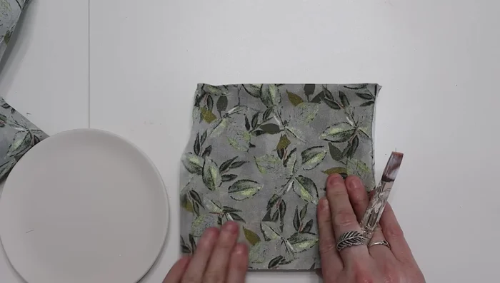 Cover the ceramic dishes with fabric using Mod Podge.