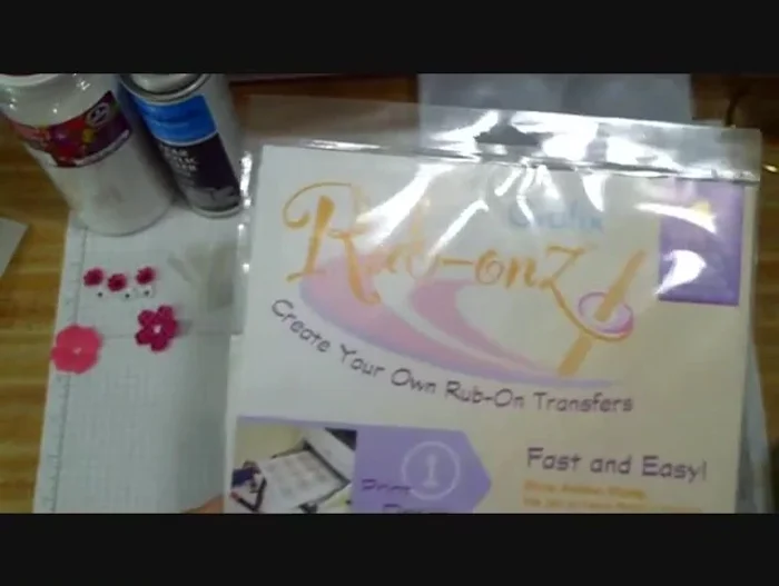 Prepare your photos or images using the rub-on transfer film. Print, stamp, or draw your design onto the matte side of the transfer film. Trim to size.