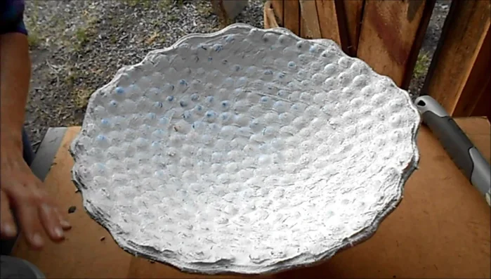 Smooth out the edges of the grout before it completely dries.