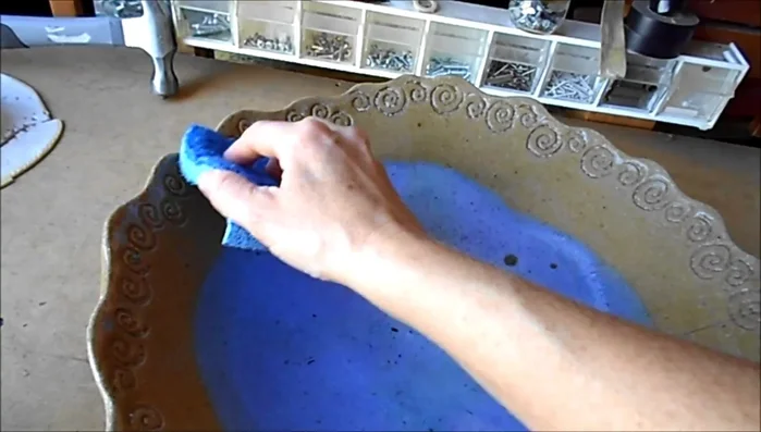 Clean and dry the bird bath surface.