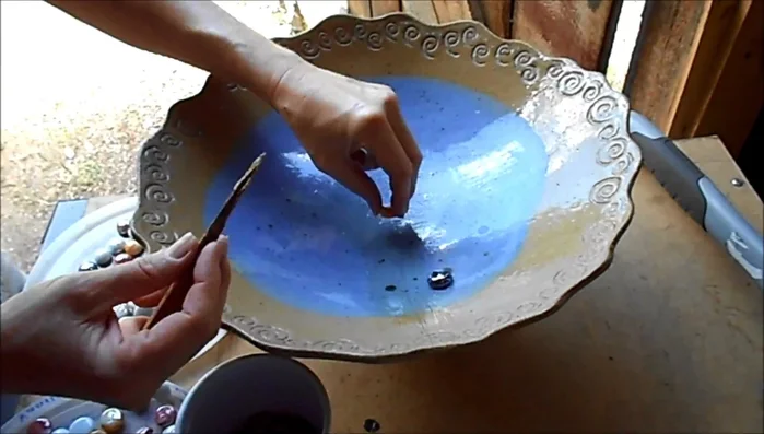 Continue placing beads, working from the center outwards, following your design.