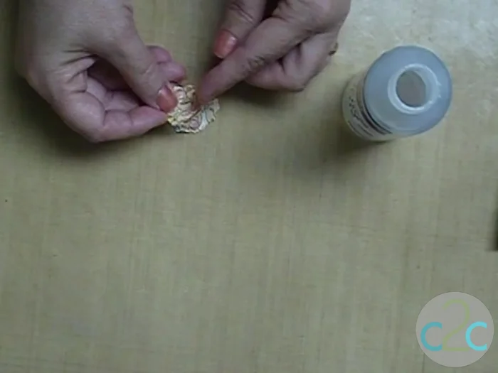 Let the flower decoration dry completely. Then, apply more clear gel to the entire flower to seal and strengthen it.