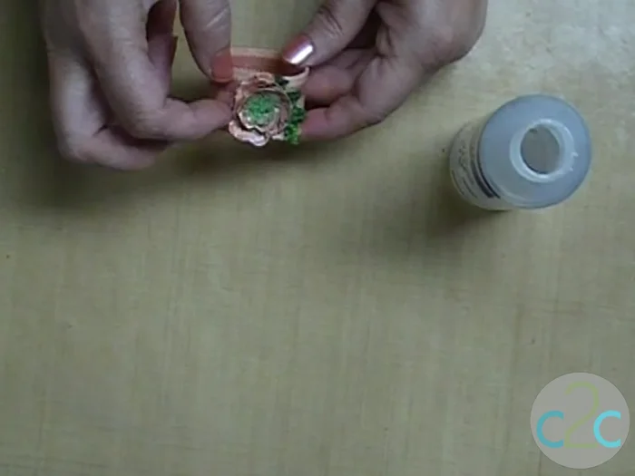 Attach the dried flower decoration to your dried napkin ring.