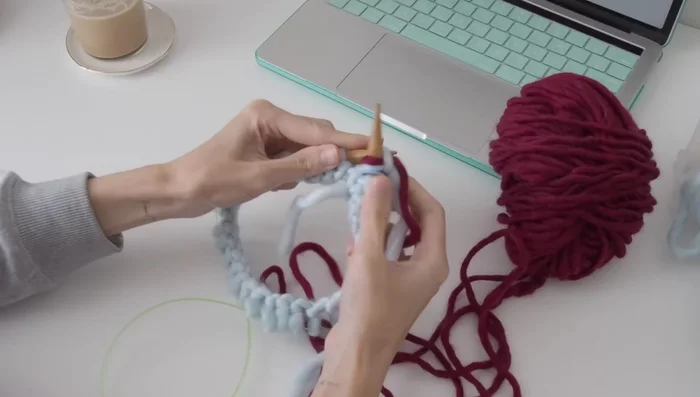 Work one by one rib in the round.