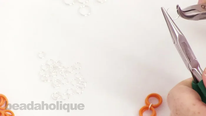 Close the 10mm jump ring, ensuring it's flush and secure.