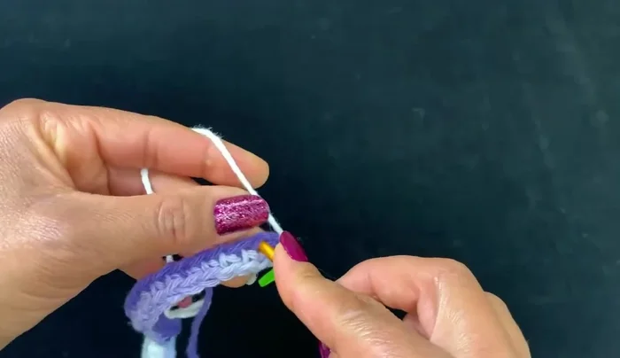 Continue round two (single crochet) until the edges meet in the middle, forming a pocket.