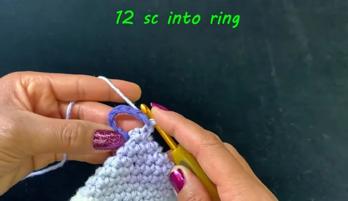 Flip the item over and secure the ring by weaving the yarn tail through several loops.