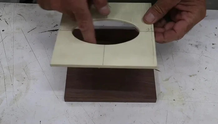 Shape the top edges: Use a round-over bit in the router table to round over the top and bottom of the oval, and create a subtle profile on the top edge.