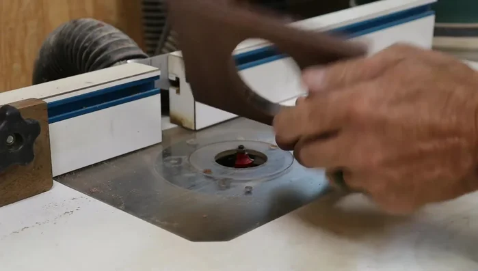 Shape the top edges: Use a round-over bit in the router table to round over the top and bottom of the oval, and create a subtle profile on the top edge.